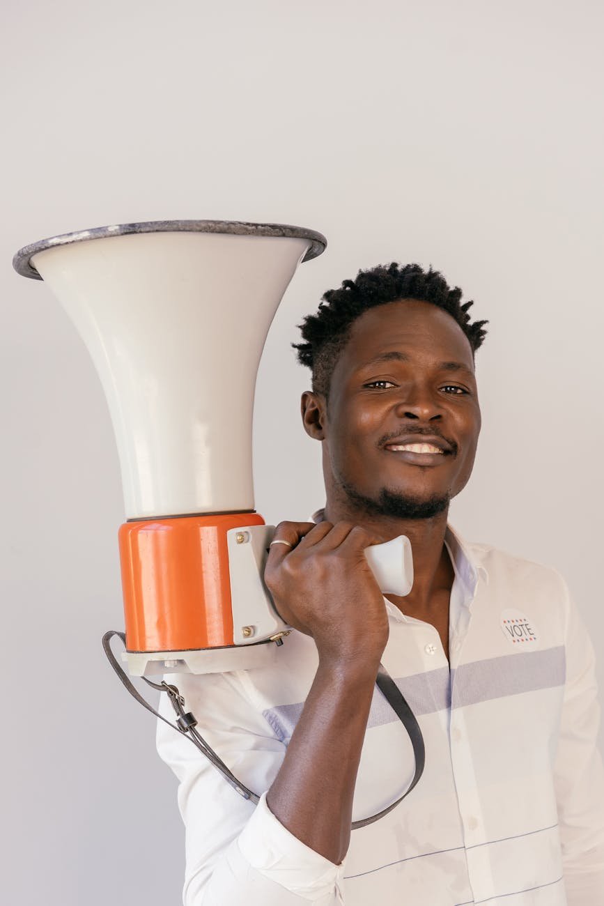 close up photo of man holding megaphone